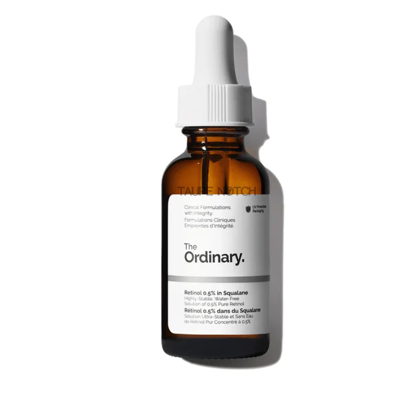 Retinol serum bottle with white dropper cap, amber glass, The Ordinary branding.
