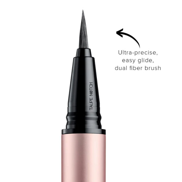 Liquid eyeliner pen with pointed brush tip and pink barrel