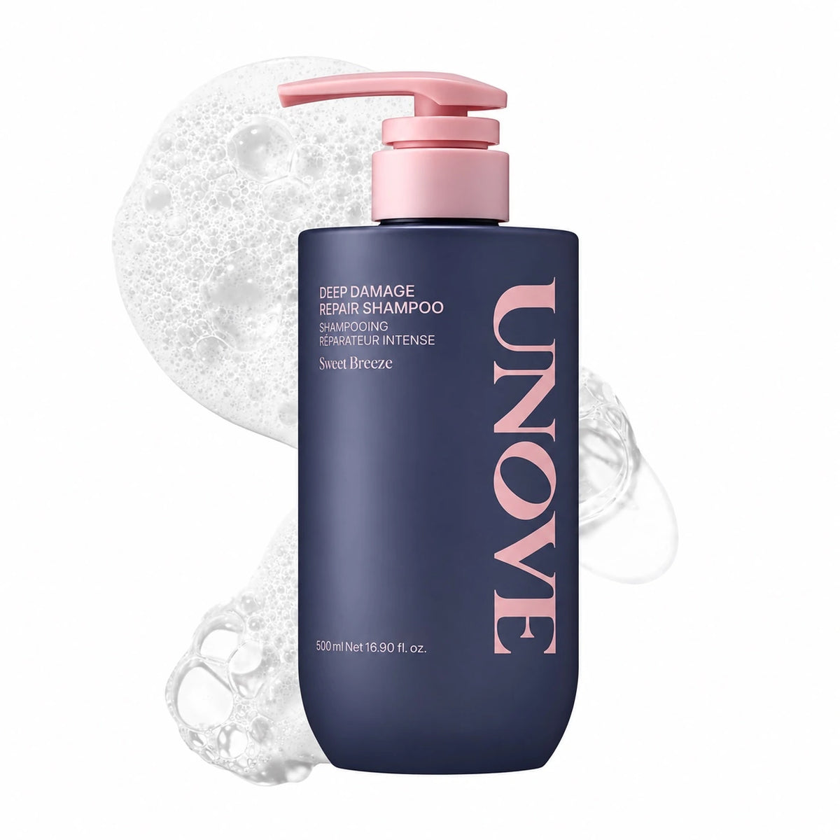 Deep damage repair shampoo bottle with pink pump, dark navy bottle with bubbles