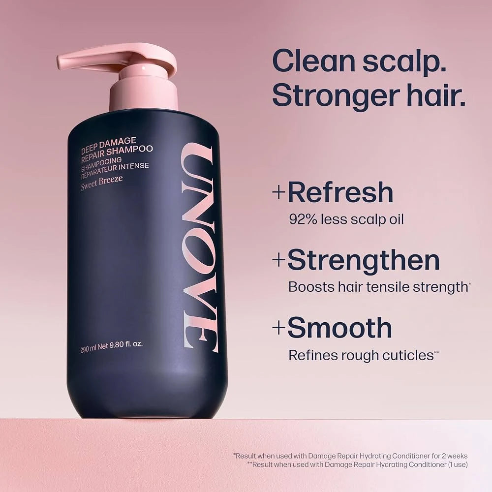 Deep damage repair shampoo bottle, dark navy with pink pump and rose lettering