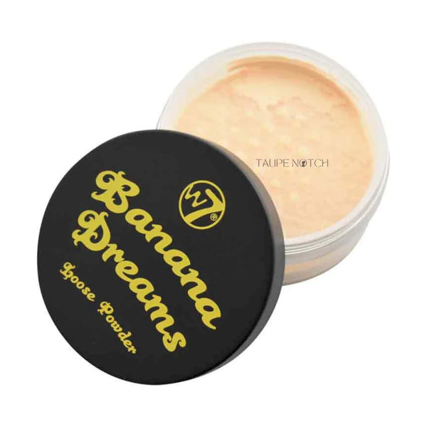 Loose powder compact with open pan, beige powder, black lid with gold logo