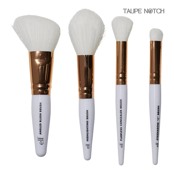 Elf rose gold travel brush kit with four makeup brushes, gold-toned ferrules, white bristles.